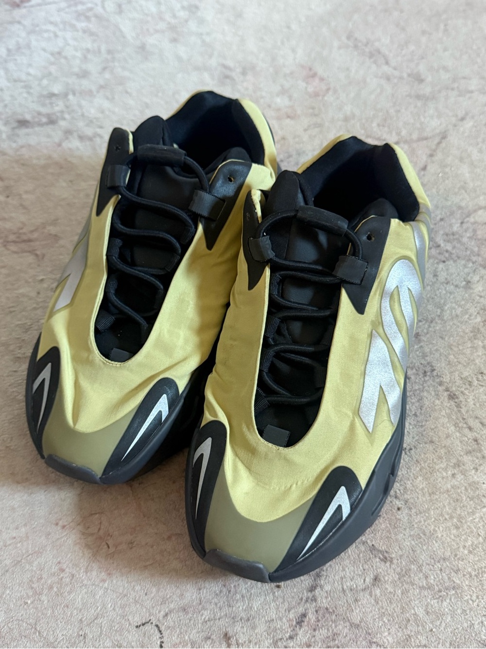Yeezy Yellow and Black Sneakers with Silver Detailing